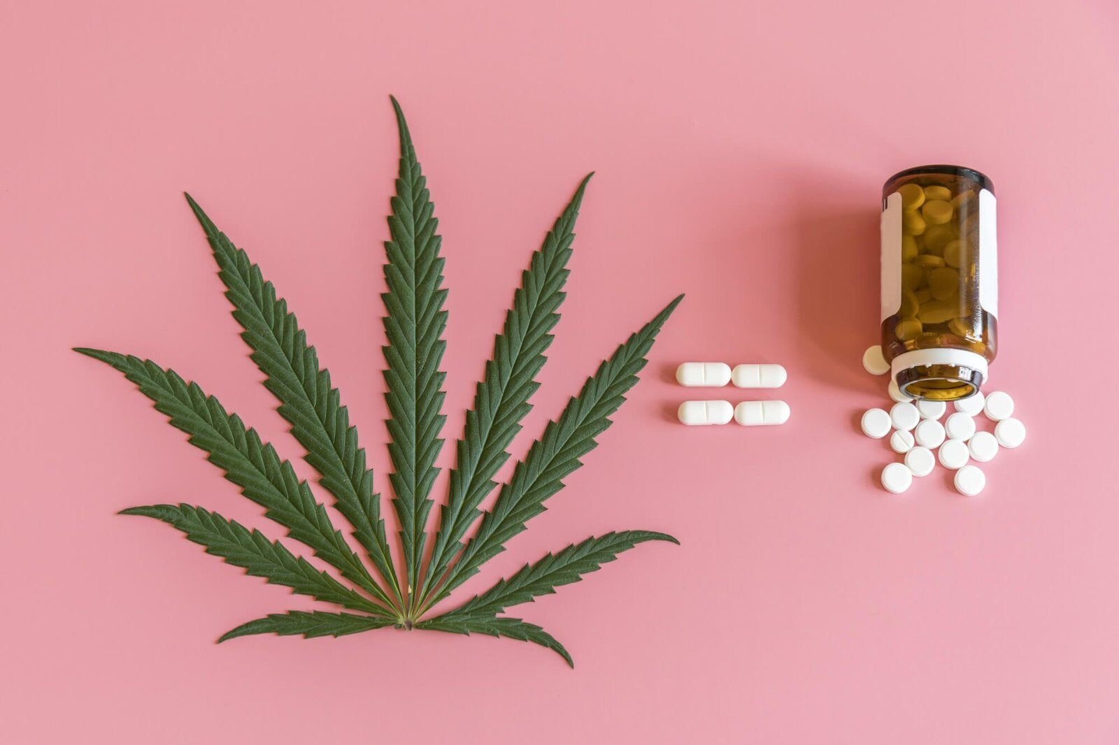 marijuana leaf and prescription pills